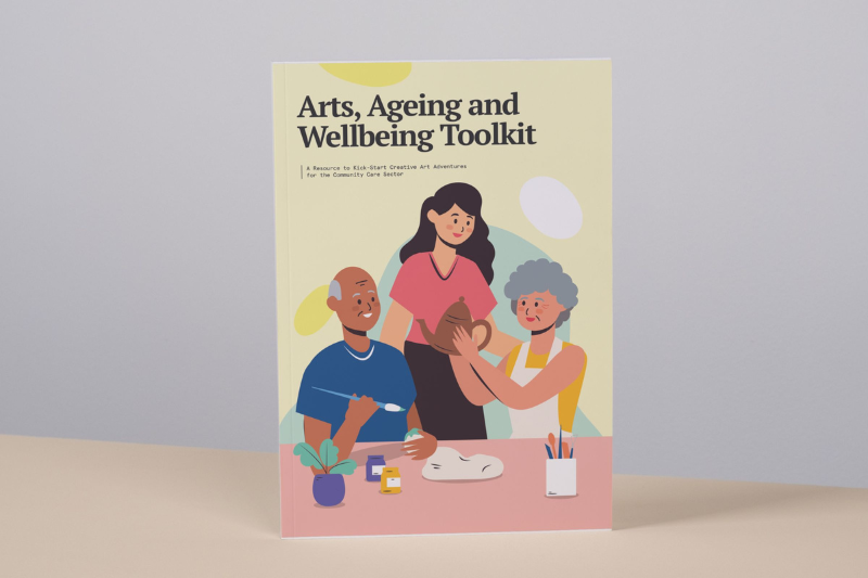 Picture shows cover of Art, Ageing and Wellbeing Toolkit, which shows a trio of individuals from different races doing arts & craft like pottery