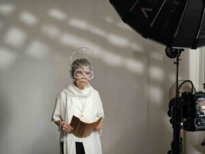 As a philosopher concerned about end-of-life matters, Soh Joo poses in a white costume wearing a handmade aluminium foil headpiece.